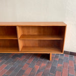 Load image into Gallery viewer,  Mid-century Teak Credenza | Hutch with Adjustable Shelving. This mid-century teak credenza | hutch is perfect for storing and displaying your items. Featuring two adjustable shelves, you can customize the configuration to suit your unique home. The timeless design is ideal for both office and home environments.
