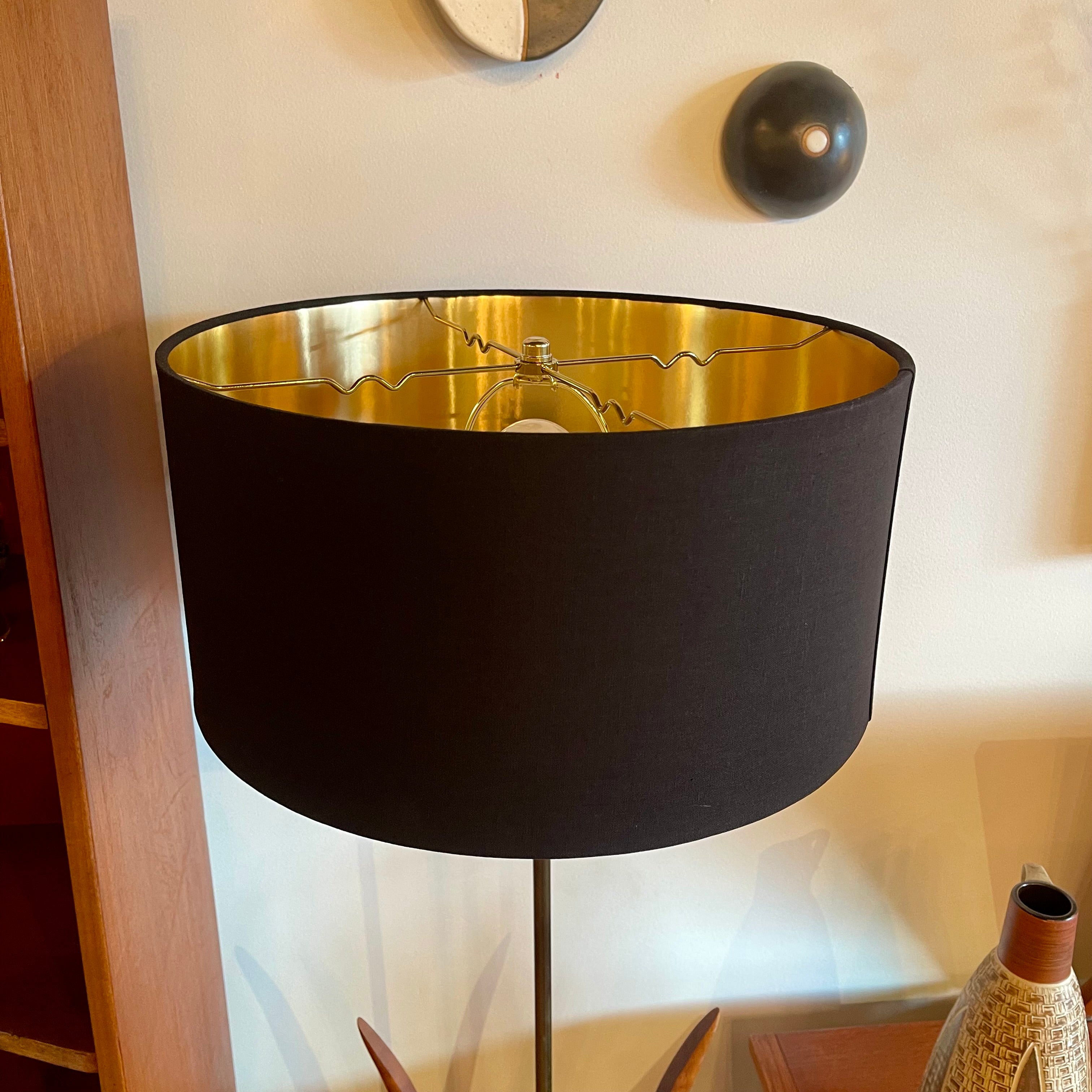 vintage mid-century walnut floor lamp with  black drum shade with gold interior.