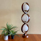 MODELINE Mid-Century Modern Globe Ring Lamp is a stunning three-tiered lighting fixture exuding a timeless Mid-Century Modern aesthetic. 