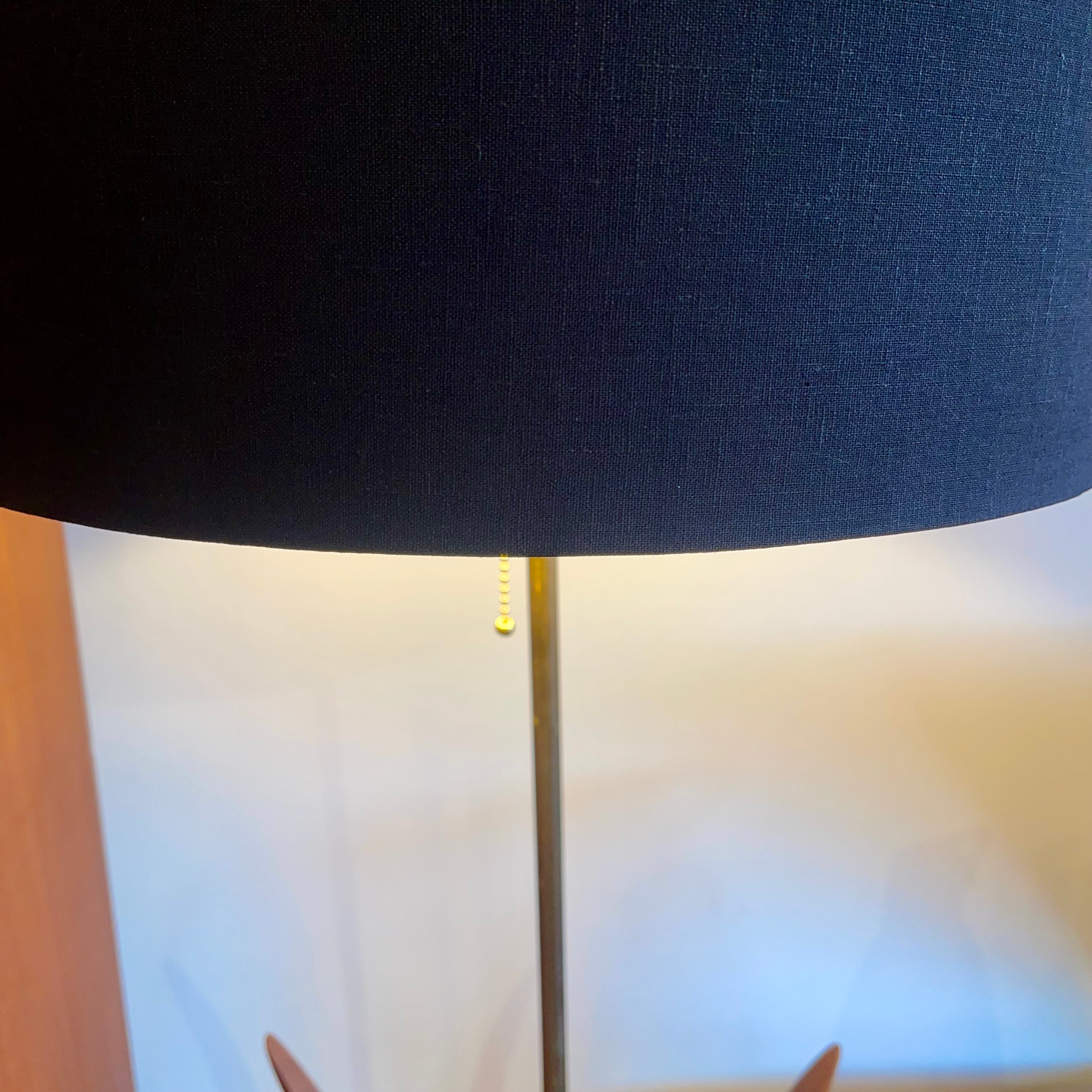 vintage mid-century walnut floor lamps with sculptural reed-inspired bases and black drum shade.