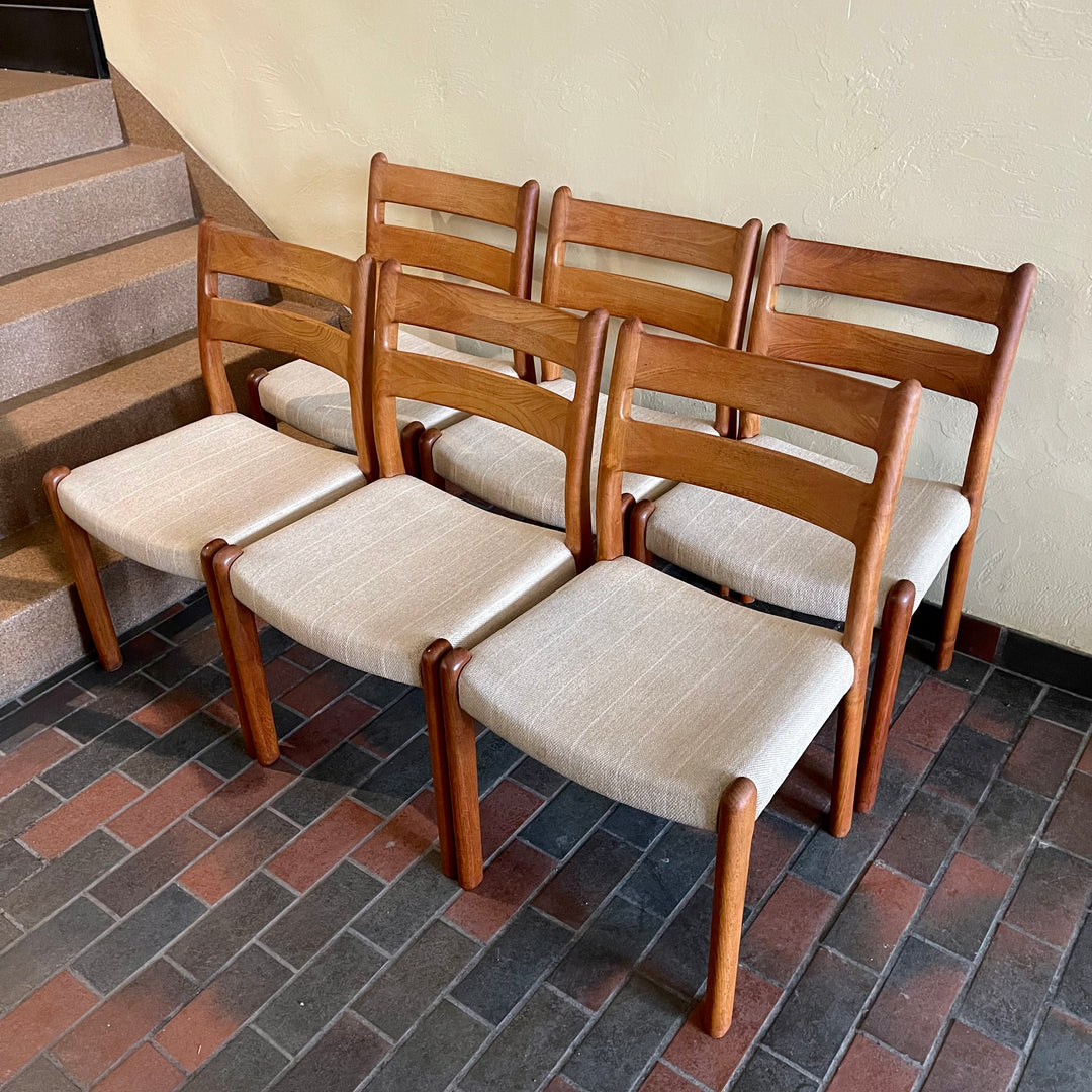 This set of six Danish Modern Solid Teak Dining Chairs from EMC Møbler showcase a sturdy craftsmanship and timeless design. Crafted from solid teak, these chairs feature a sleek and ergonomic silhouette, embodying the minimalist elegance characteristic of mid-century Danish furniture. 