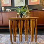 Poul Hundevad Nesting Tables, a timeless and versatile addition to your living space. This exquisite set consists of five tables, with four of them ingeniously designed as drop-leaf tables that effortlessly slide beneath the main table, offering both functionality and aesthetic appeal.