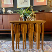 Poul Hundevad Nesting Tables, a timeless and versatile addition to your living space. This exquisite set consists of five tables, with four of them ingeniously designed as drop-leaf tables that effortlessly slide beneath the main table, offering both functionality and aesthetic appeal.