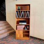 "Made in Denmark," this shelving unit not only provides a stylish platform to showcase your cherished records or favorite books but also offers functional storage solutions. 