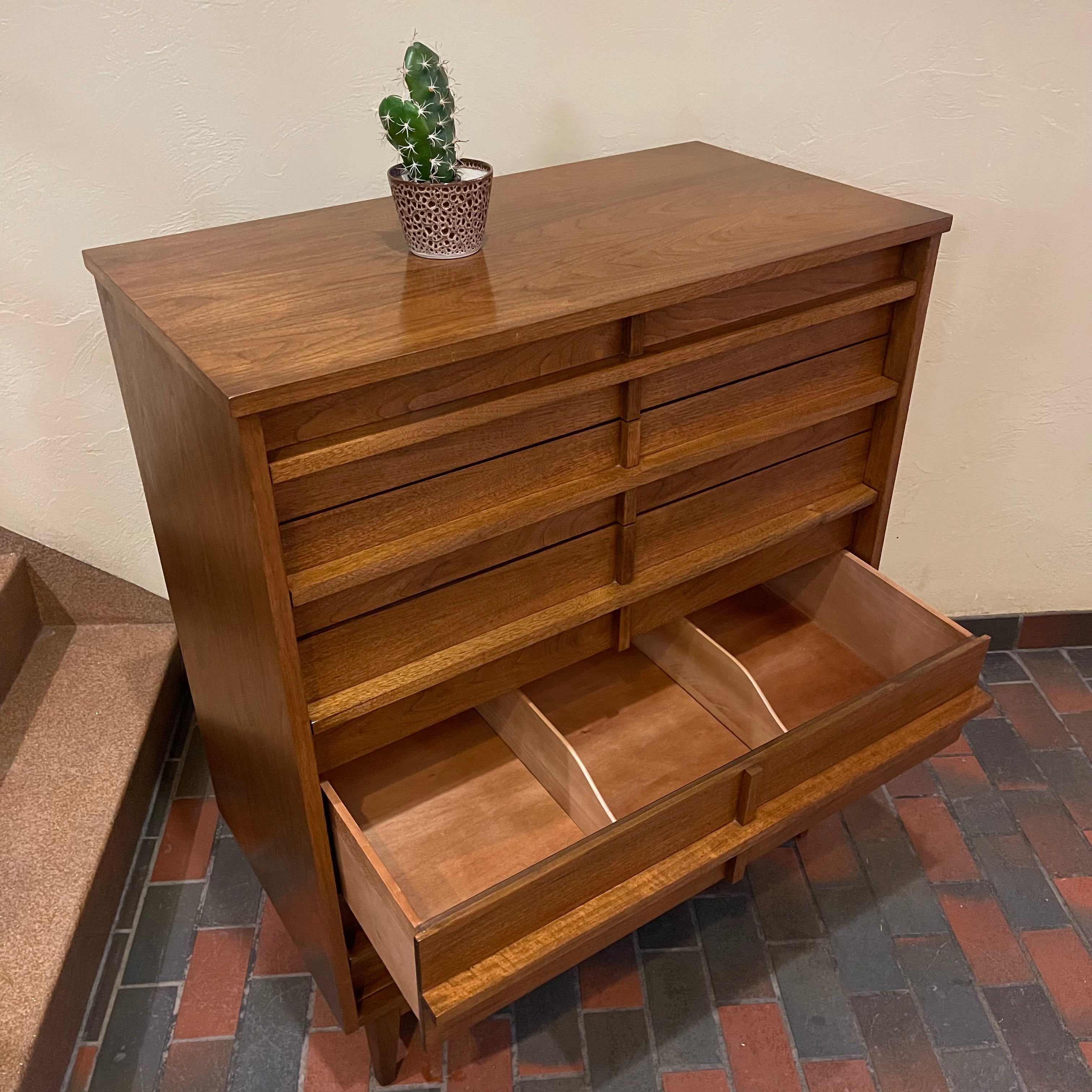 Crafted from rich walnut wood, this GIBBARD dresser boasts a warm, inviting tone that adds a touch of sophistication to any space.