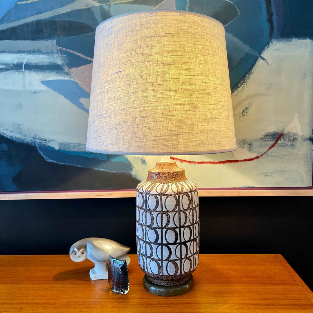  Mid Century Modern Pottery Lamp. Beautiful glazed geometric shapes adorn this pottery lamp. The  under glaze is black with brown specs and white glaze contrasting the shapes. | Mr. Mansfield Vintage 