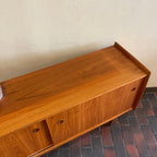 Mid century Modern R. Huber Teak Atomic Age Style Credenza with two sliding doors adjustable shelving and a drawer for storage | Record Storage | Mr. Mansfield Vintage 