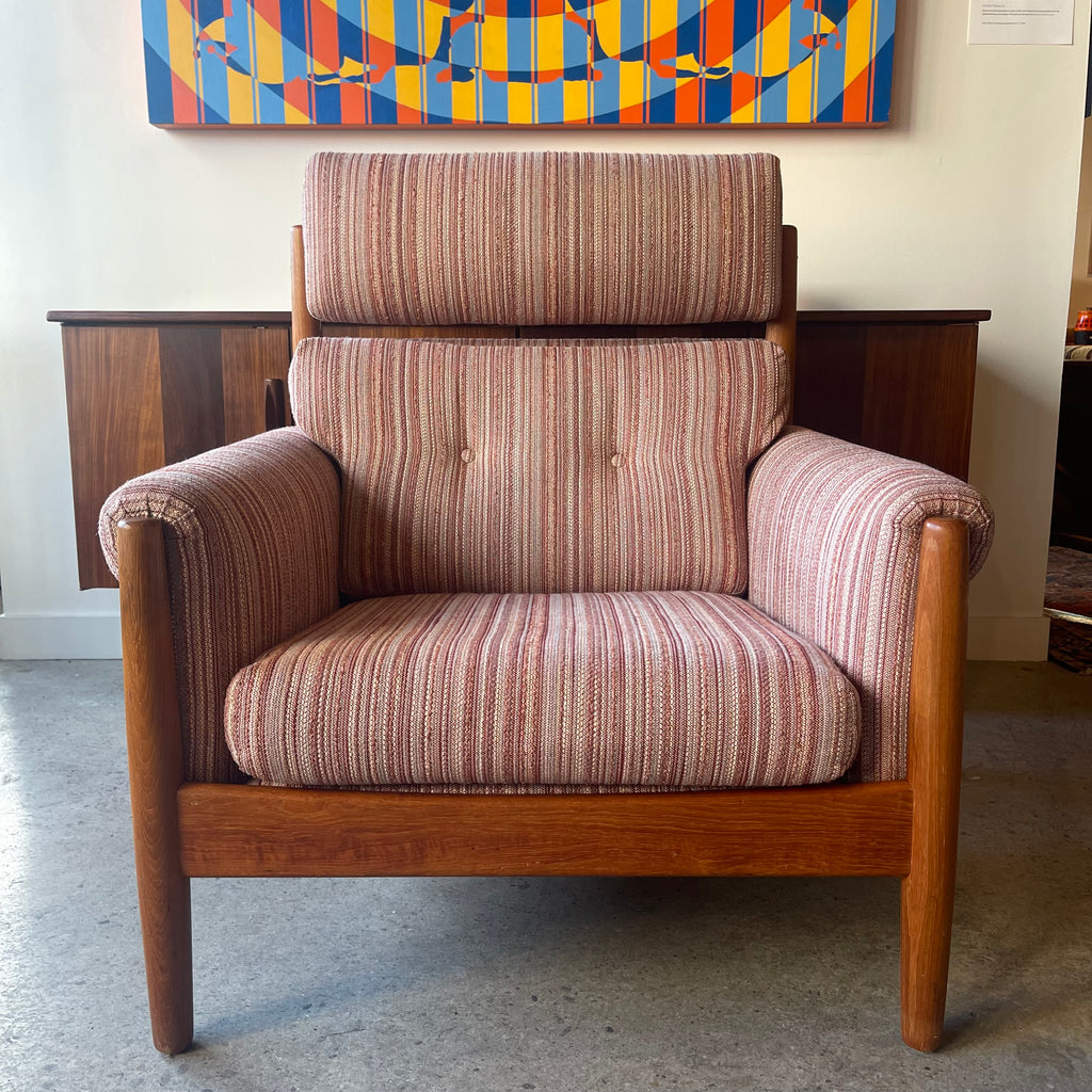 Front view of mid-century Danish teak lounge chair with striped upholstery