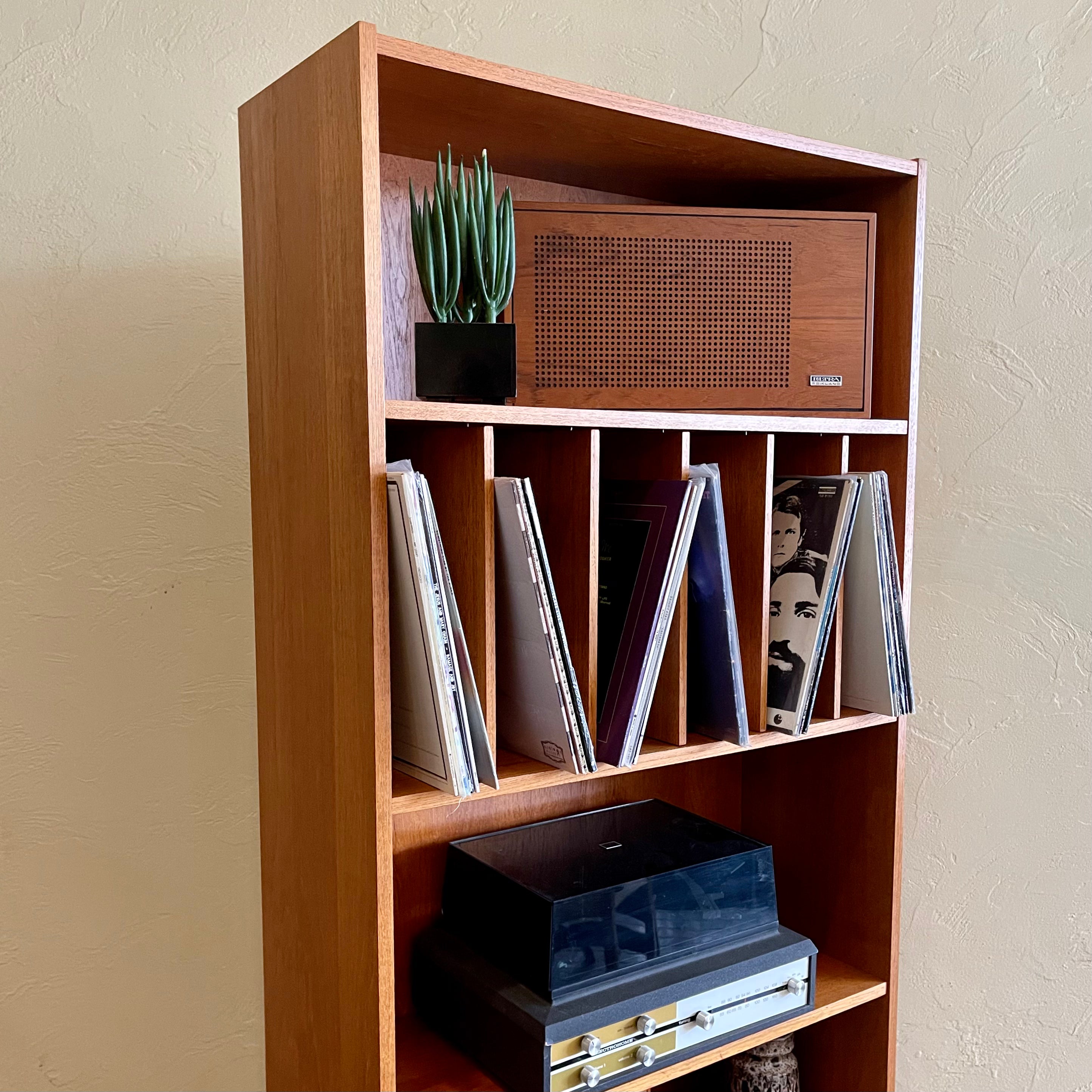 "Made in Denmark," this shelving unit not only provides a stylish platform to showcase your cherished records or favorite books but also offers functional storage solutions. 