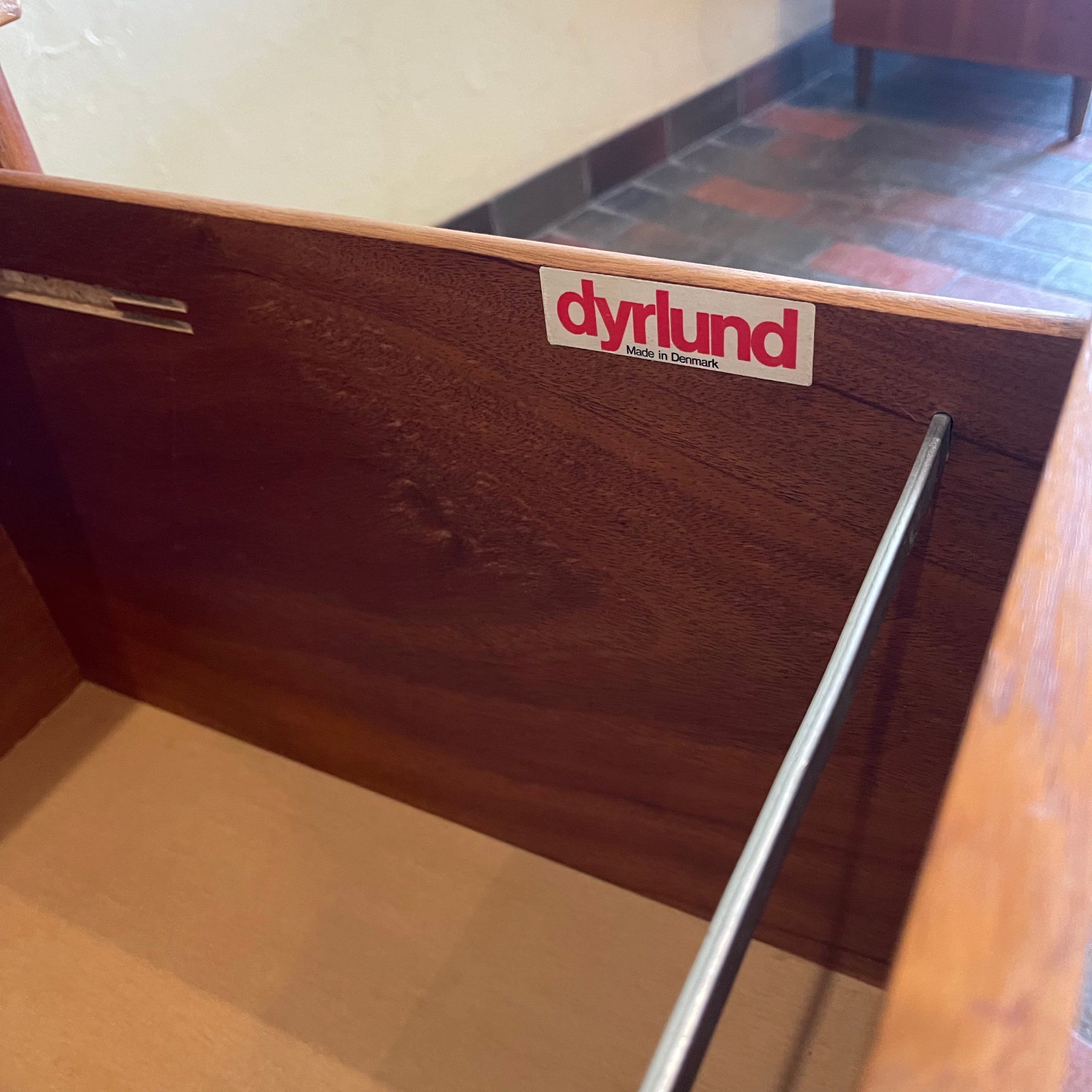 Constructed from rich and durable teak wood, this DYRLUND desk features a design that encapsulates the essence of Mid-Century Modern aesthetics. To the right, a spacious drawer provides practical storage for documents, ensuring a clutter-free workspace. On the left, three drawers offer additional organizational space, perfect for keeping essentials close at hand.