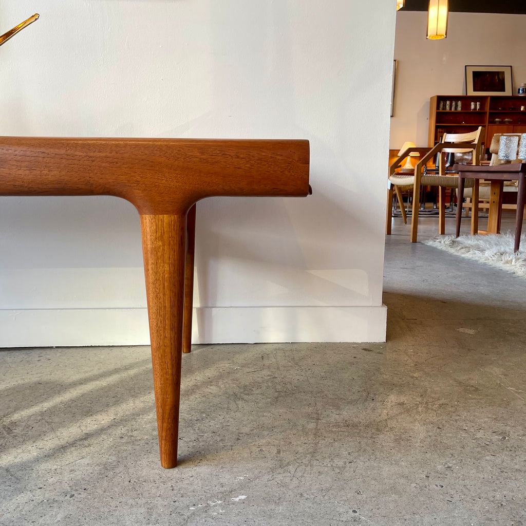 Close-up of right tapered teak leg on Johannes Andersen teak coffee table