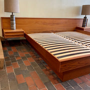 The centerpiece of any bedroom, this platform bed features a clean, minimalist design with a low-profile frame that offers a sense of spaciousness. The headboard, showcasing the natural beauty of teak, adds a touch of organic allure to the overall aesthetic. Its seamless integration with the floating nightstands on both sides creates a cohesive and balanced look.
