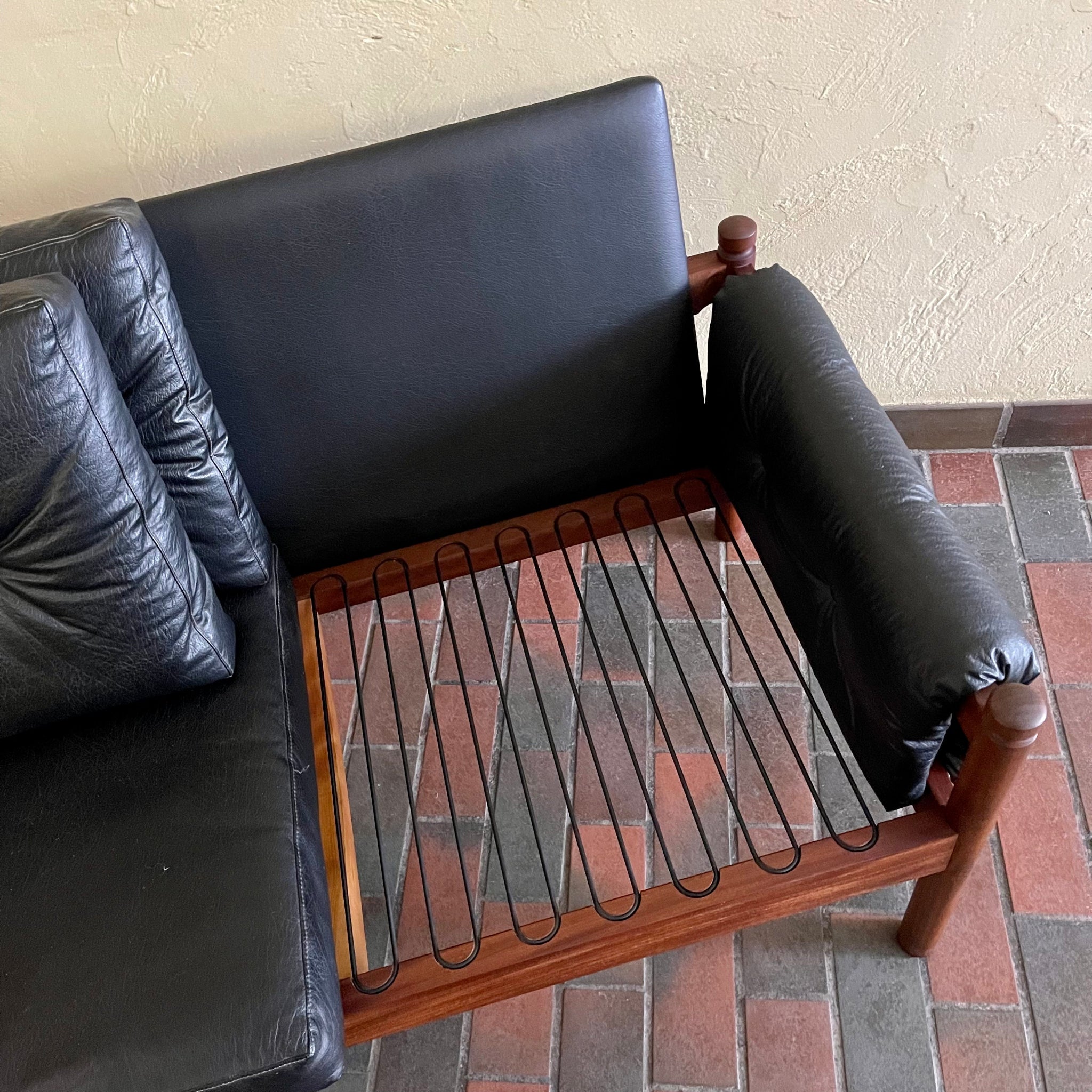 Teak frame detail on RS Associates black sofa