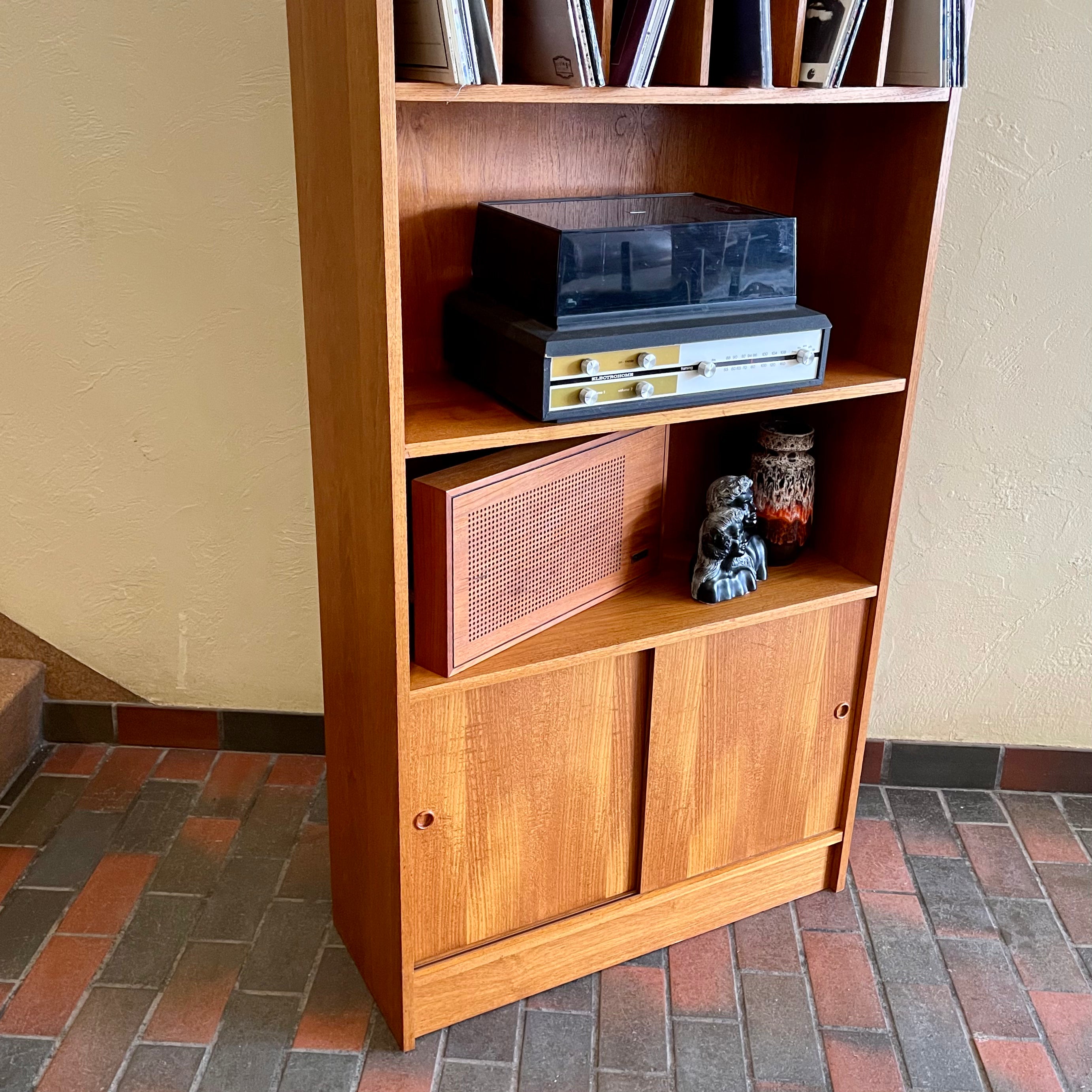 "Made in Denmark," this shelving unit not only provides a stylish platform to showcase your cherished records or favorite books but also offers functional storage solutions. 