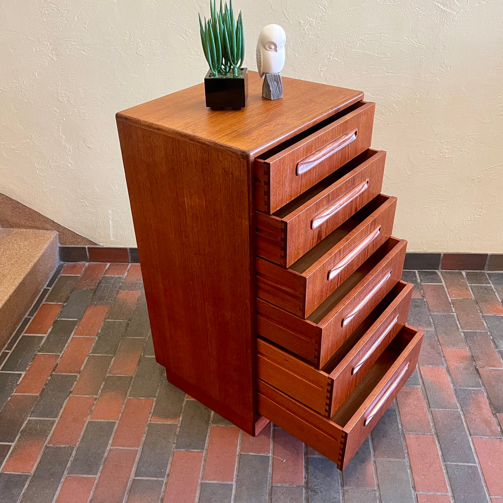 Open drawer on vintage G Plan teak chest showing dovetail joinery and interior storage