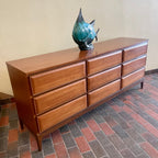 Angled view of HPL Furniture walnut dresser showing long low profile