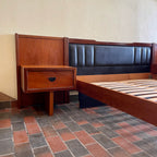 Wide teak R.S. Associates headboard with built-in nightstands for queen or double bed