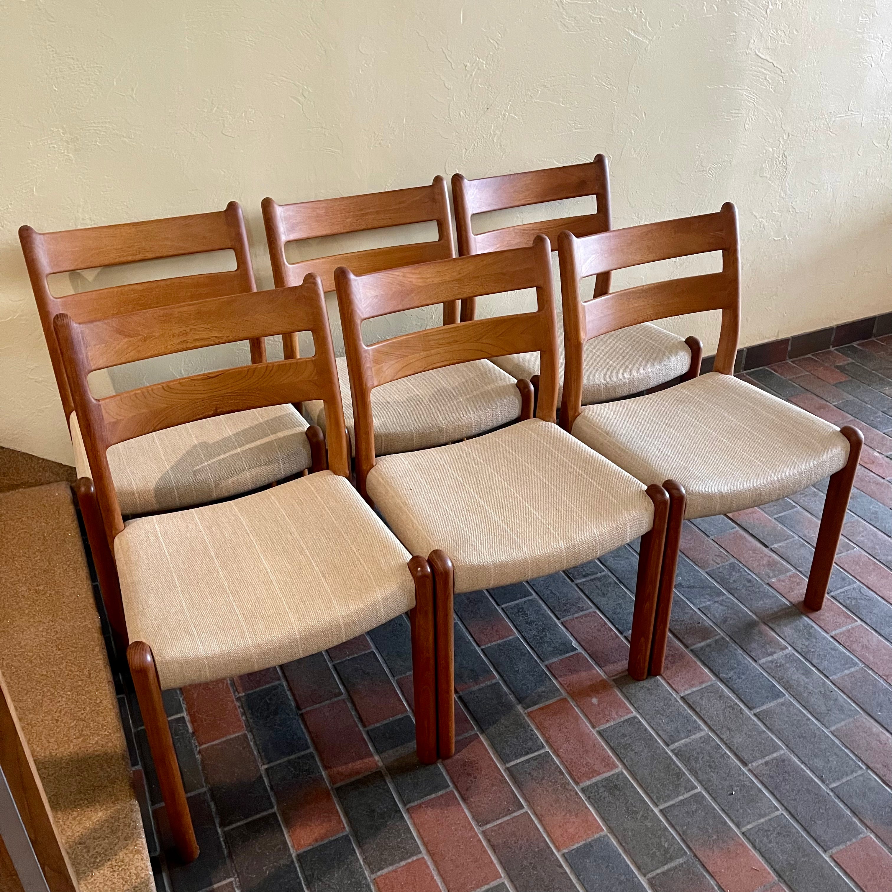 This set of six Danish Modern Solid Teak Dining Chairs from EMC Møbler showcase a sturdy craftsmanship and timeless design. Crafted from solid teak, these chairs feature a sleek and ergonomic silhouette, embodying the minimalist elegance characteristic of mid-century Danish furniture. 