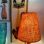 Load image into Gallery viewer, This small vintage solid teak lamp exudes mid-century charm. The original burnt orange shade adds a pop of retro flair, casting a soft, ambient glow.