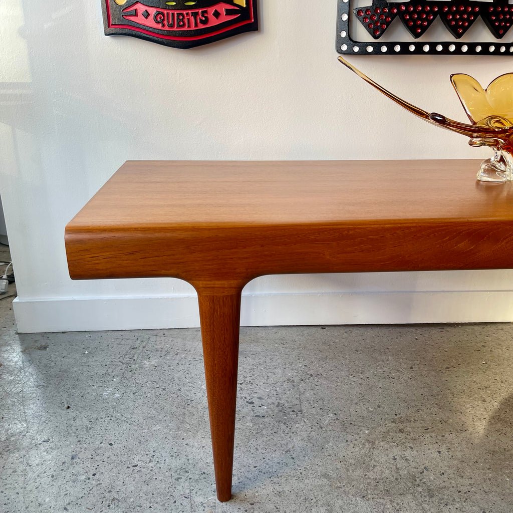 Close-up of left tapered teak leg on Johannes Andersen Danish modern table
