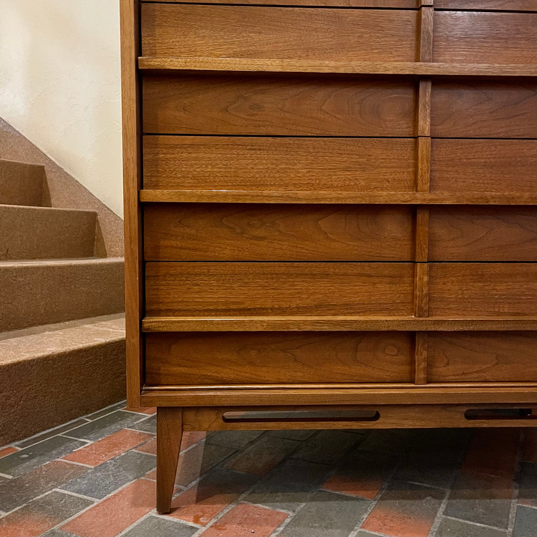 Crafted from rich walnut wood, this GIBBARD dresser boasts a warm, inviting tone that adds a touch of sophistication to any space.