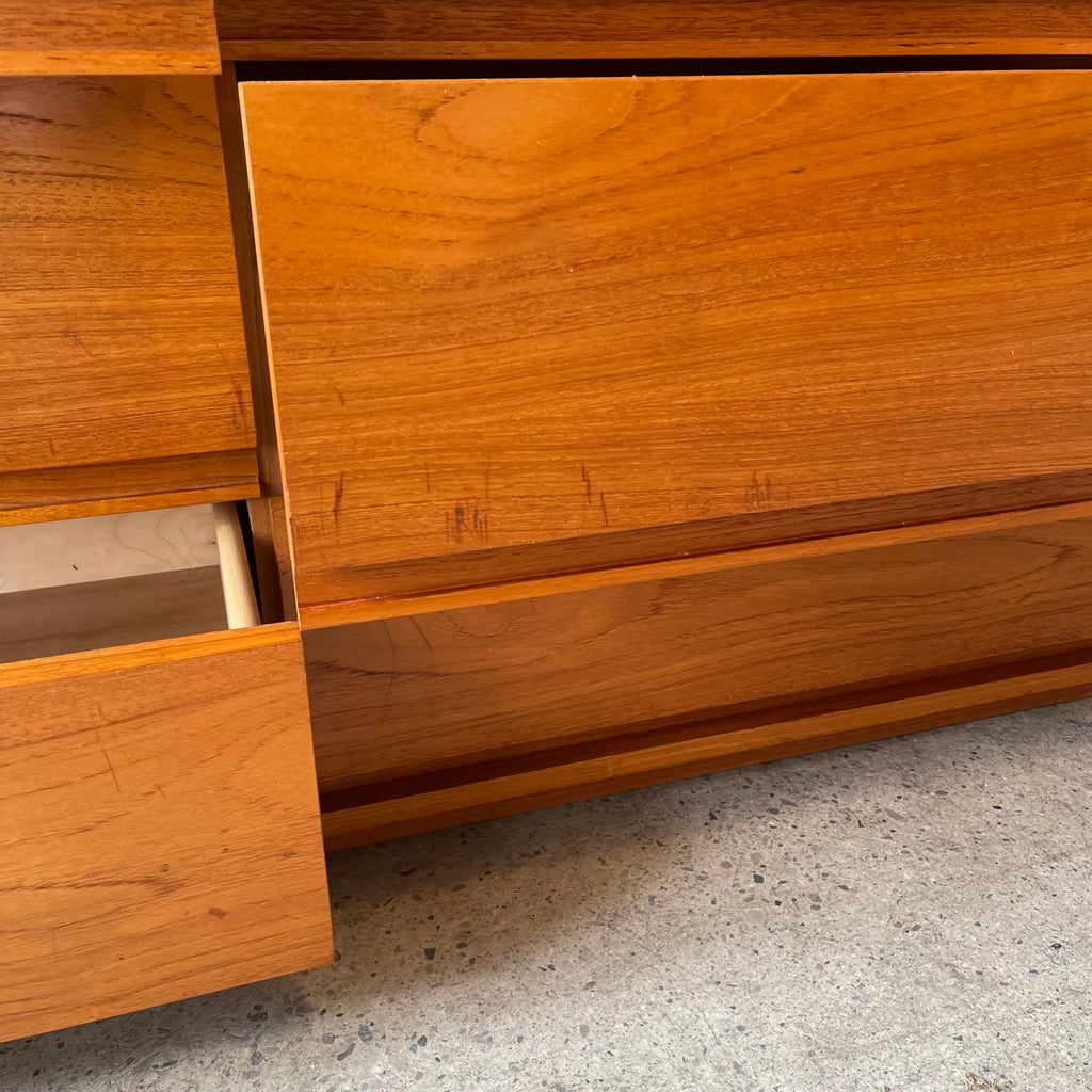 Surface scratch detail on teak drawer front