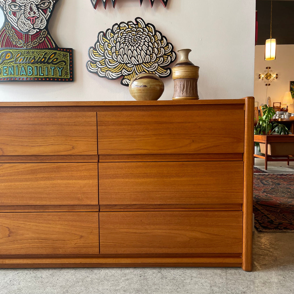 Close-up of continuous teak grain across drawer fronts