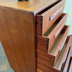 Close up of Open drawer on vintage G Plan teak chest showing dovetail joinery and interior storage