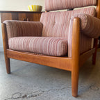Close-up of solid teak frame on mid-century Danish lounge chair