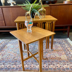 Mid Century Poul Hundevad Nesting Tables, a timeless and versatile addition to your living space. This exquisite set consists of five tables, with four of them ingeniously designed as drop-leaf tables that effortlessly slide beneath the main table, offering both functionality and aesthetic appeal.
