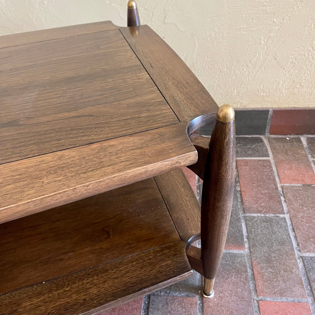 top view Close-up of brass-capped legs on vintage walnut and mahogany coffee table