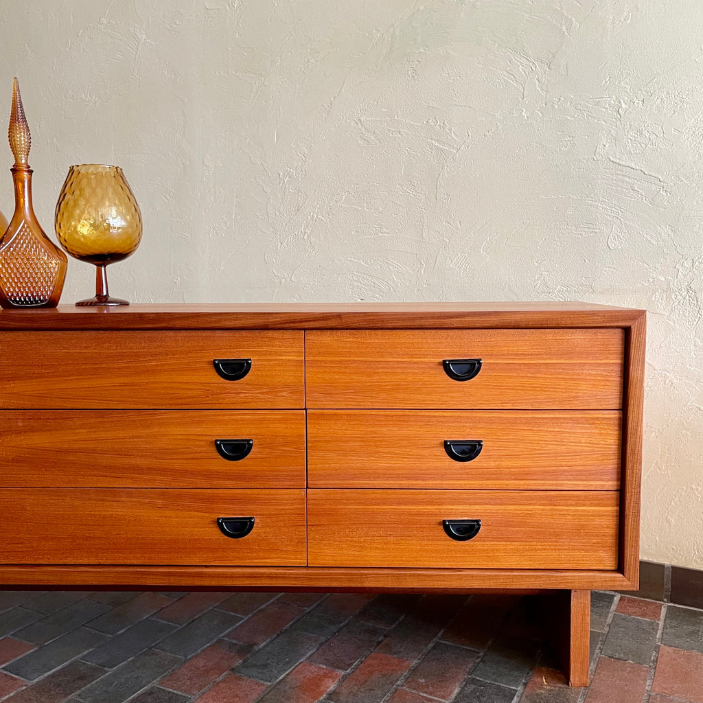 Close-up of black metal pulls on R.S. Associates teak mid-century dresserstorage
