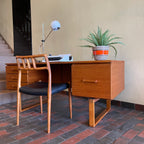 Constructed from rich and durable teak wood, this DYRLUND desk features a design that encapsulates the essence of Mid-Century Modern aesthetics. To the right, a spacious drawer provides practical storage for documents, ensuring a clutter-free workspace. On the left, three drawers offer additional organizational space, perfect for keeping essentials close at hand.