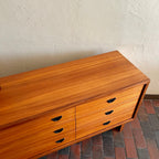top view of teak grain on vintage R.S. Associates nine drawer dresser