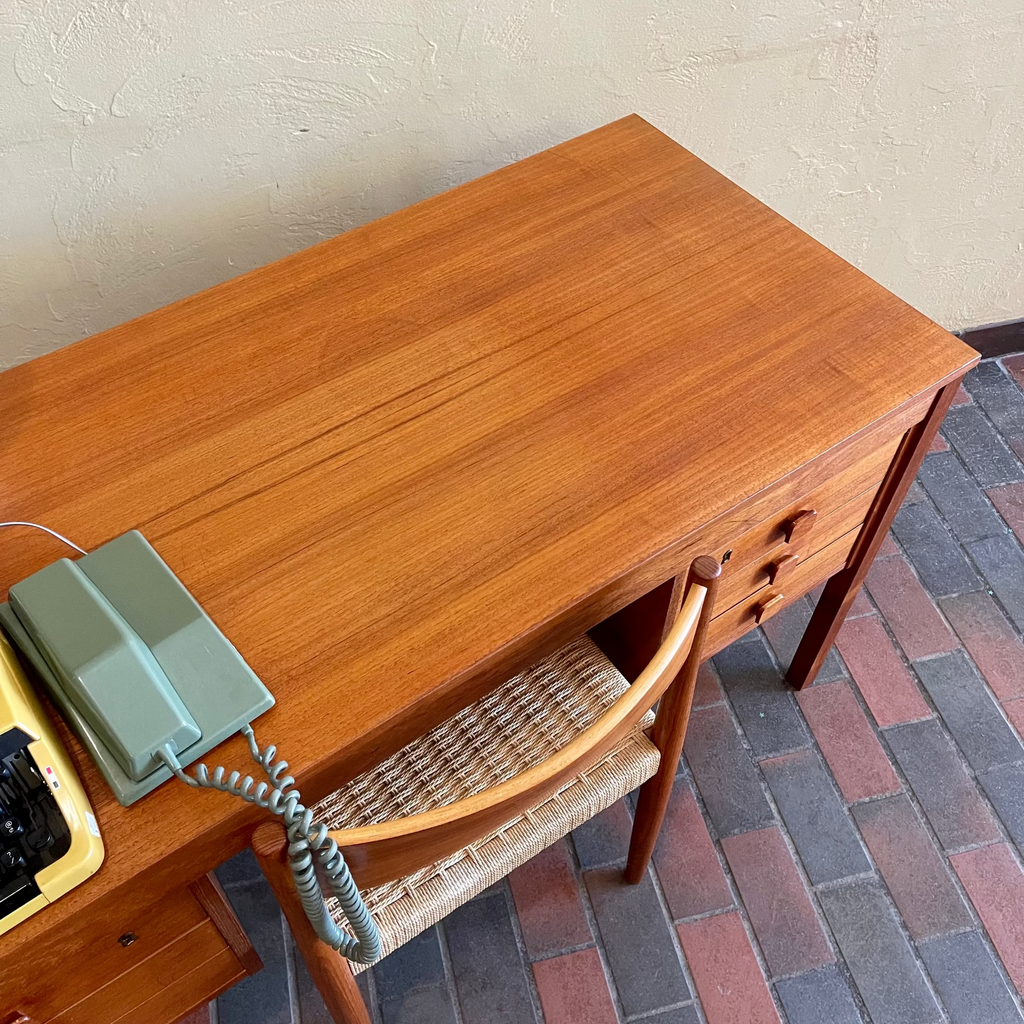 Light surface wear on vintage Danish teak desk