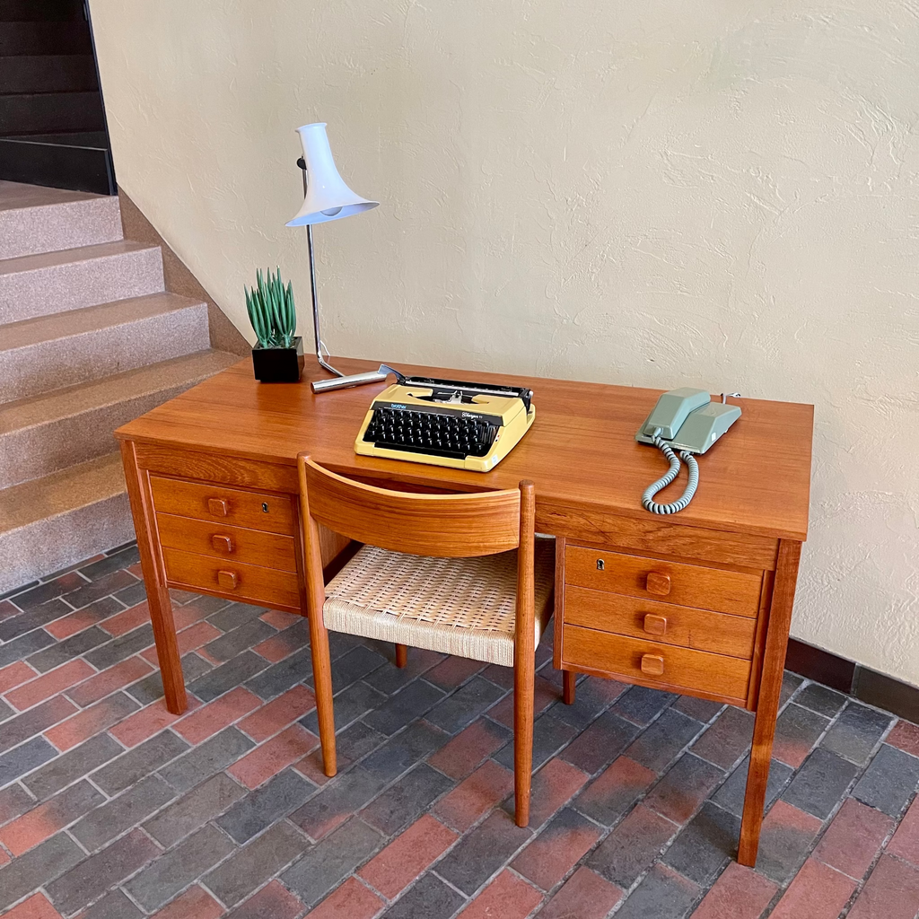 Domino Møbler teak desk with six dovetailed drawers