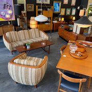 Huber Sofa and chair in Mr. Mansfield Store surrounded by teak table and chairs, vintage lamps, vintage dressers