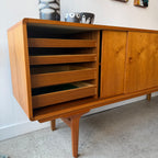 Teak drawer fronts with felt-lined interiors