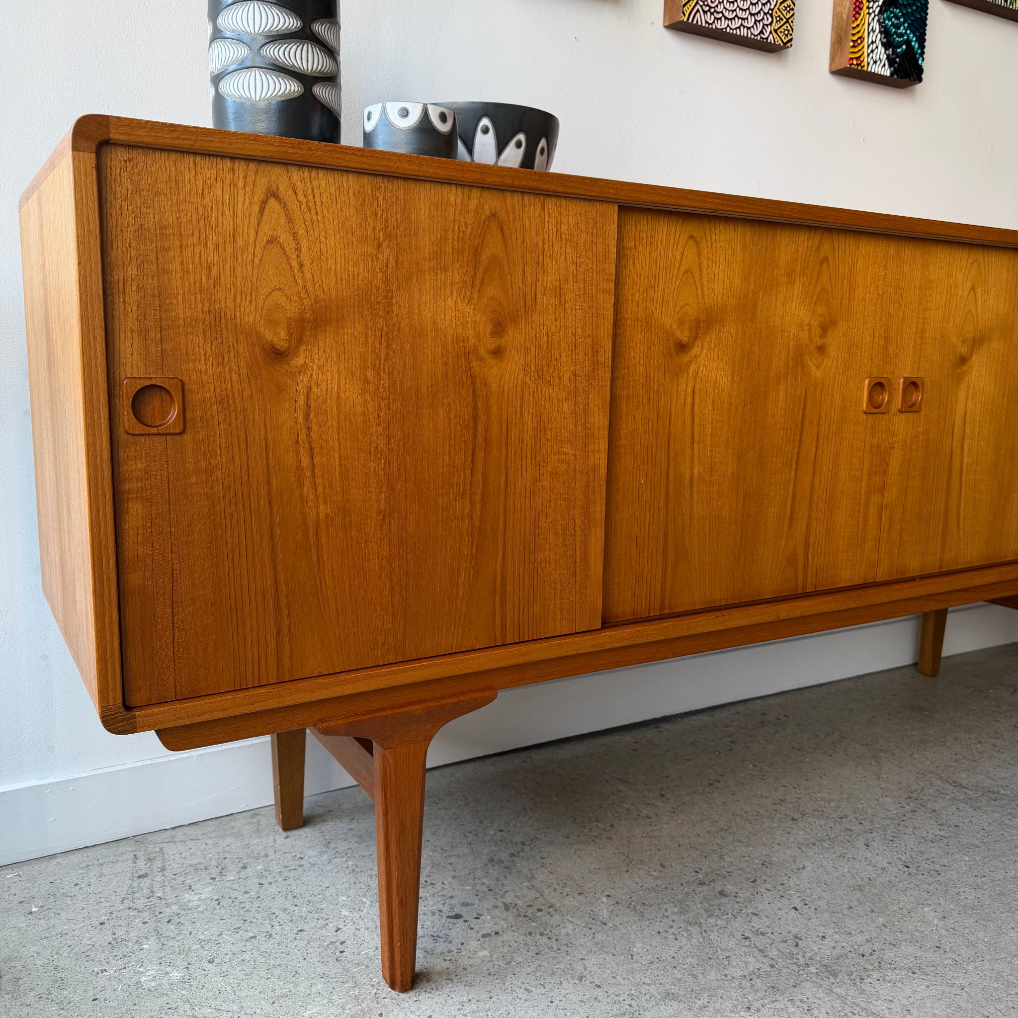 Round recessed handle on mid-century teak credenza