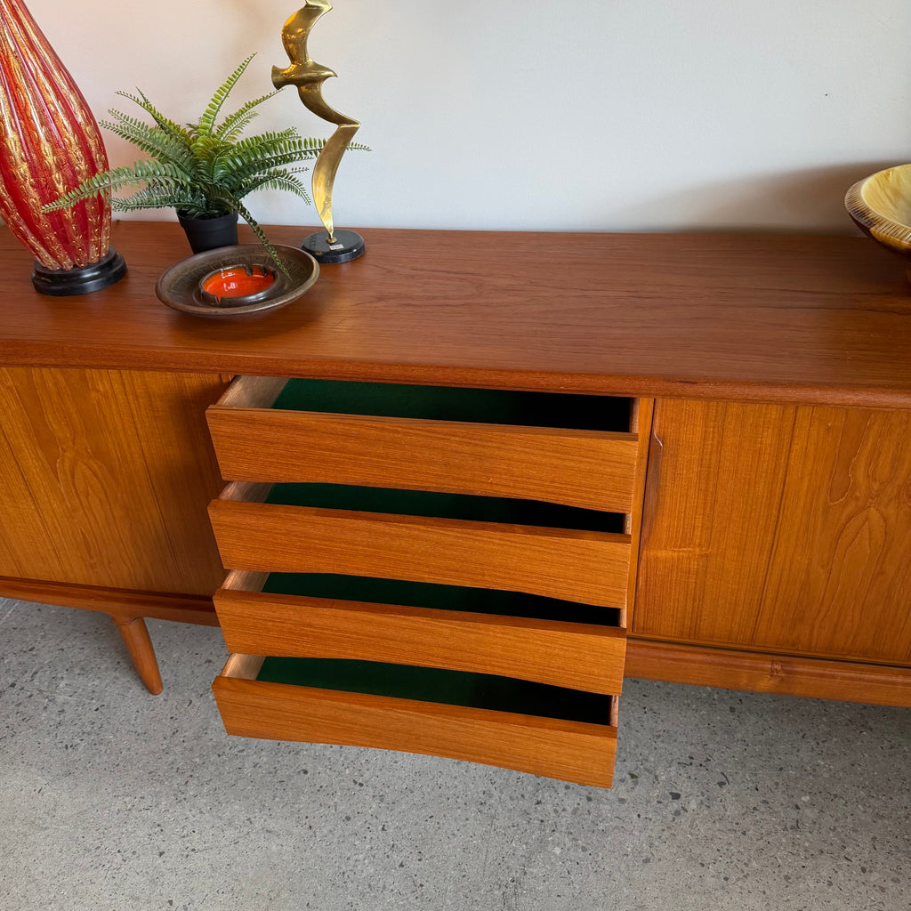 Centre drawers open on Danish teak sideboard