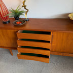 Centre drawers open on Danish teak sideboard