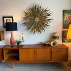 Styled view of Axel Christiansen teak sideboard with vintage decor