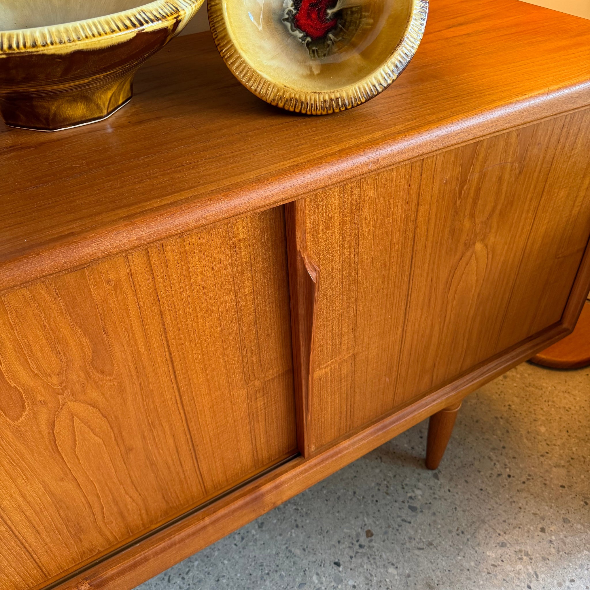 Close-up of teak sliding door on Axel Christiansen sideboard