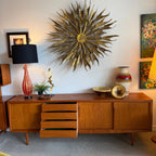 Centre drawers open on Danish teak sideboard