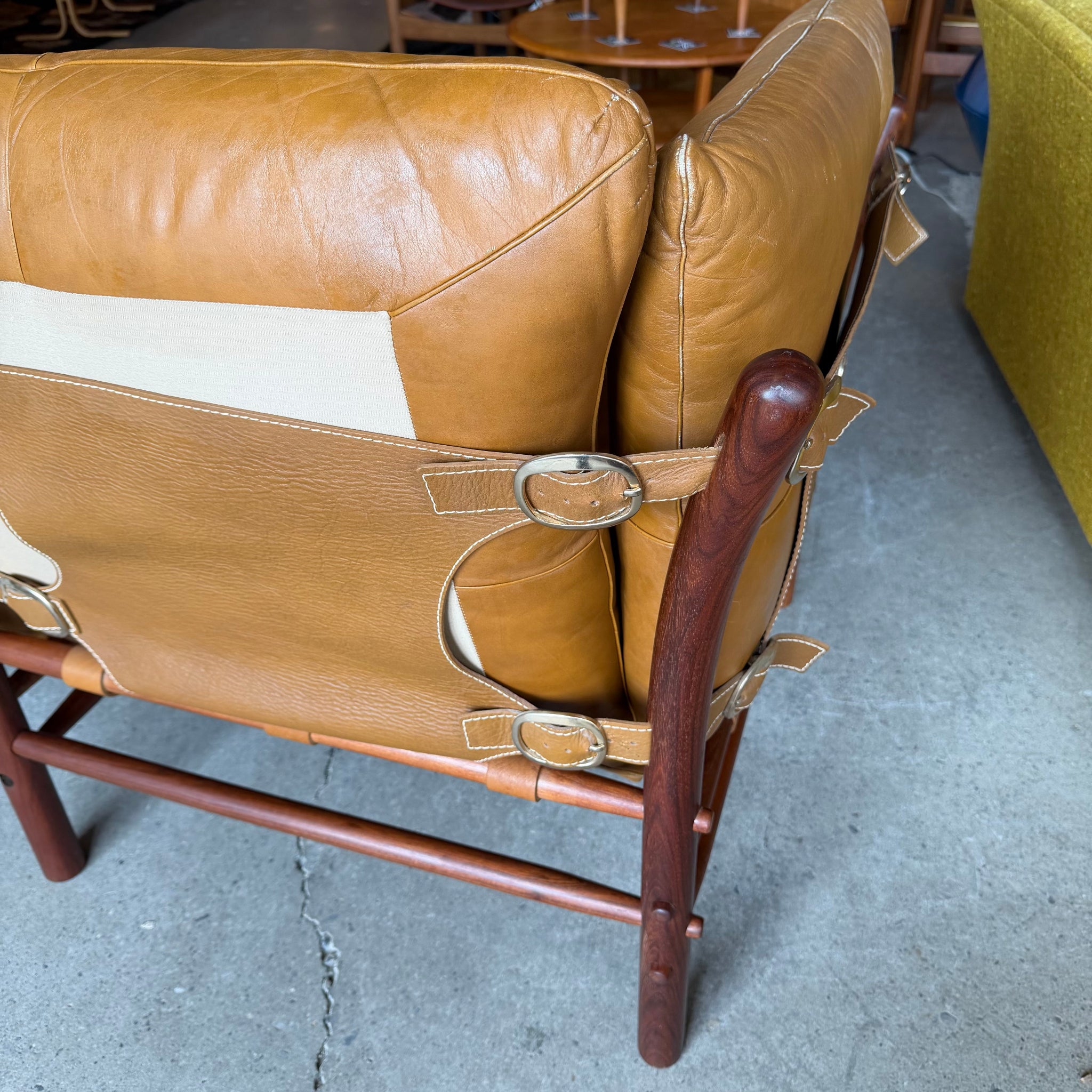 Buckle detail on back of Scanform leather loveseat