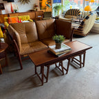 Vintage teak nesting tables styled with leather loveseat