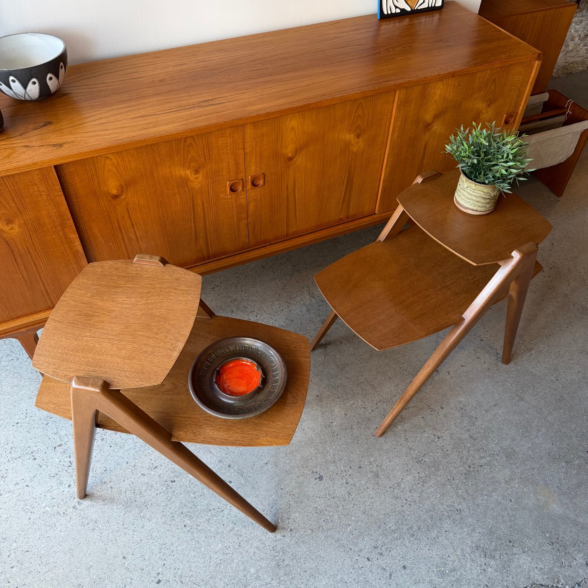 Two-tier tabletop detail on vintage wood side tables
