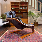 Rear view of Kroken lounge chair showing bentwood frame and leather sling seat