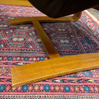 Close-up of curved teak frame base on Swedish Kroken lounge chair