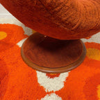 Swivel base detail on R. Huber scoop chair